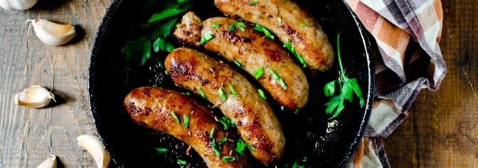 chilled-sausage-card-bg Sausages in a frying pan